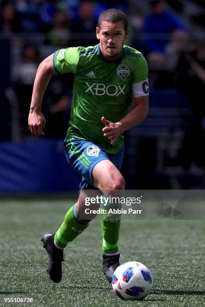 Osvaldo Alonso of Seattle Sounders dribbles with the ball in the second half against the Columbus Crew during their game at CenturyLink Field on May...