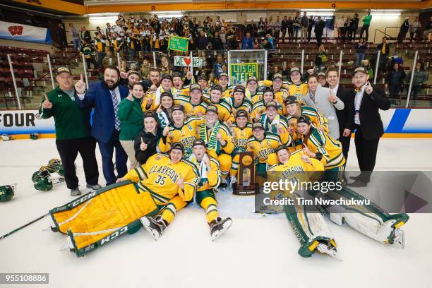 Clarkson University players celebrate with the championship trophy after winning the Division I Women's Ice Hockey Championship held at Ridder Arena...