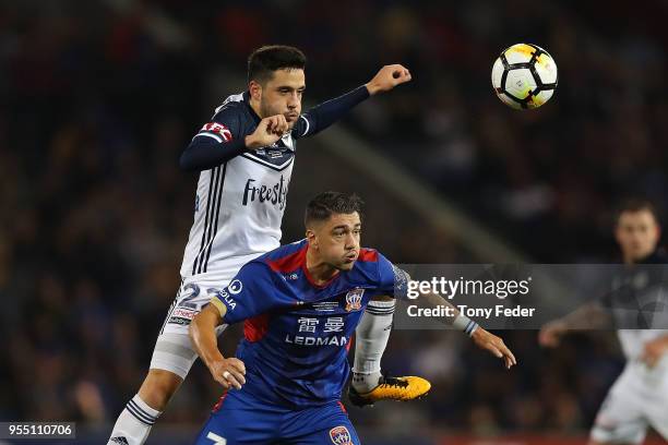 Dimitri Petratos of the Jets contests the ball with Stefan Nigro of the Victory during the 2018 A-League Grand Final match between the Newcastle Jets...