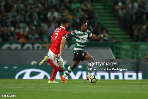 Sporting CP forward Gelson Martins from Portugal tries to escape SL Benfica midfielder Andreas Samaris from Greece during the Portuguese Primeira...