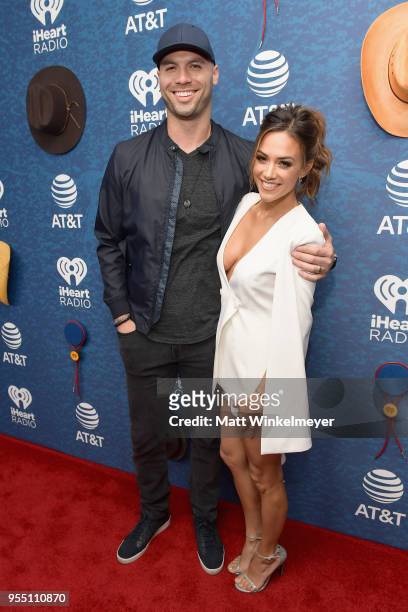 Mike Caussin and Jana Kramer arrive at the 2018 iHeartCountry Festival By AT&T at The Frank Erwin Center on May 5, 2018 in Austin, Texas.