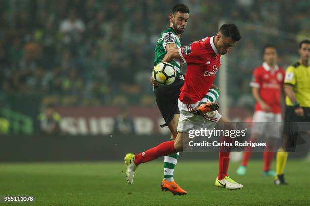 Sporting CP midfielder Bruno Fernandes from Portugal vies with SL Benfica midfielder Andreas Samaris from Greece for the ball possession during the...