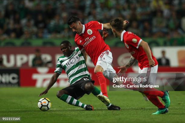 Sporting CP midfielder William Carvalho from Portugal tackled by SL Benfica midfielder Andreas Samaris from Greece during the Portuguese Primeira...