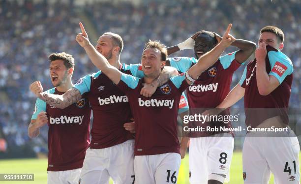 West Ham United's Mark Noble celebrates scoring his side's second goal during the Premier League match between Leicester City and West Ham United at...