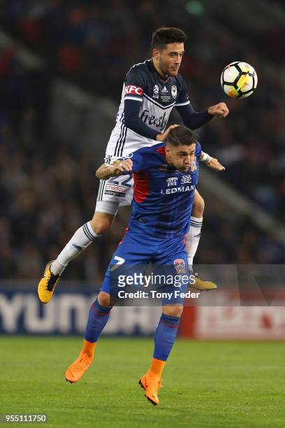 Dimitri Petratos of the Jets contests the ball with Stefan Nigro of the Victory during the 2018 A-League Grand Final match between the Newcastle Jets...