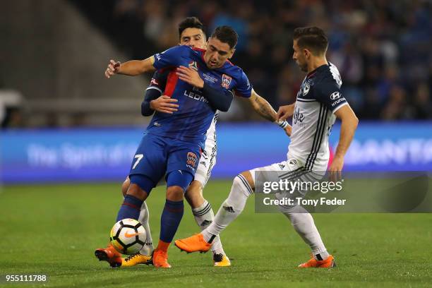 Dimitri Petratos of the Jets contests the ball with Stefan Nigro of the Victory during the 2018 A-League Grand Final match between the Newcastle Jets...