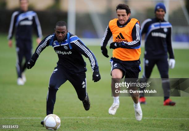 Gael Kakuta and Juliano Belletti of Chelsea in action during a training session at Chelsea Training Ground on December 31, 2009 in Cobham, England.