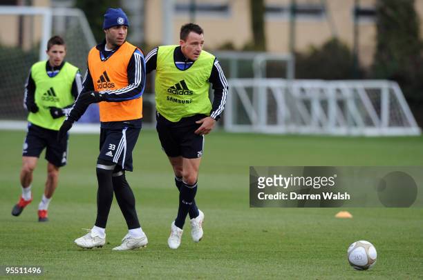 Alex and John Terry of Chelsea during a training session at Chelsea Training Ground on December 31, 2009 in Cobham, England.