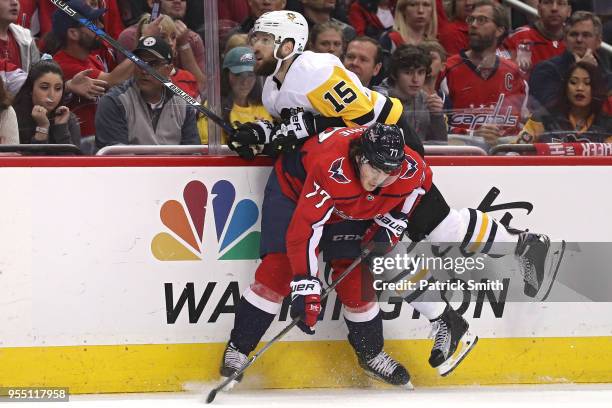 Oshie of the Washington Capitals checks Riley Sheahan of the Pittsburgh Penguins during the first period in Game Five of the Eastern Conference...