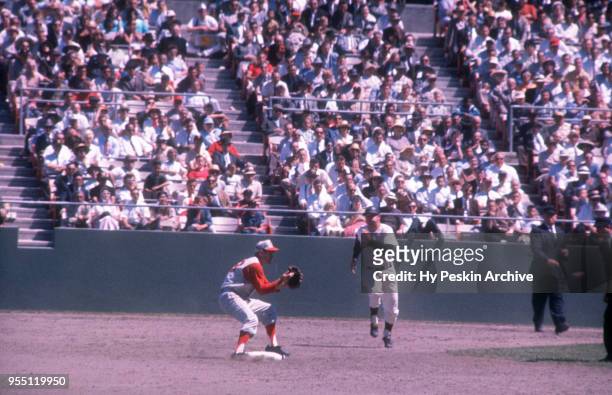 Don Blasingame of the Cincinnati Reds receives the ball as Harvey Kuenn of the San Francisco Giants runs towards second base during an MLB game on...