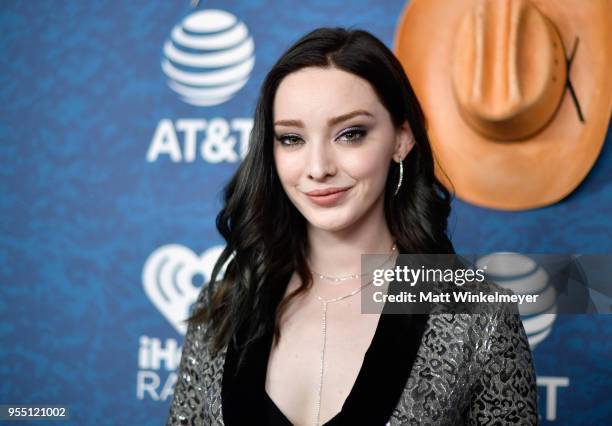 Emma Dumont arrives at the 2018 iHeartCountry Festival By AT&T at The Frank Erwin Center on May 5, 2018 in Austin, Texas.