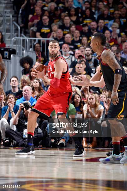 Jonas Valanciunas of the Toronto Raptors handles the ball against the Cleveland Cavaliers during Game Three of the Eastern Conference Semi Finals of...