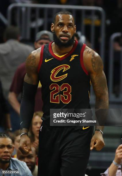 LeBron James of the Cleveland Cavaliers reacts to a first half play while playing the Toronto Raptors in Game Three of the Eastern Conference...