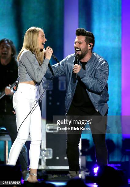 Danielle Bradbery performs with Shay Mooney of musical group Dan + Shay onstage during the 2018 iHeartCountry Festival By AT&T at The Frank Erwin...