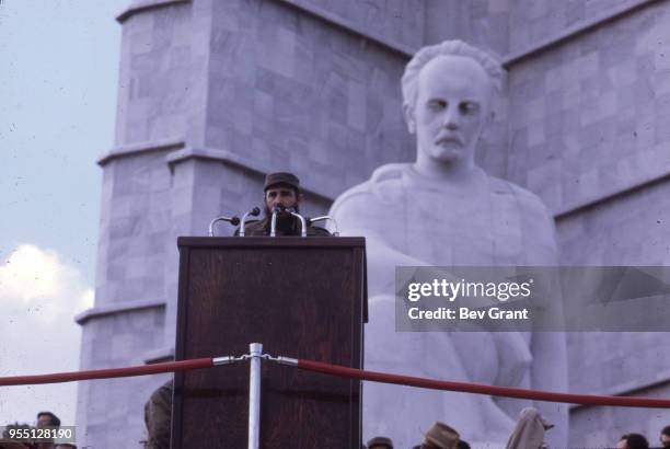 During the 10th anniversary celebration of the Cuban Revolution, military and political leader Prime Minister Fidel Castro speaks from a podium in la...