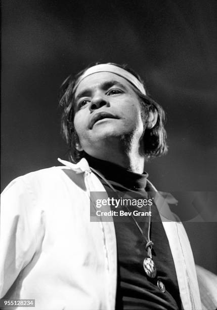 Low-angle view of an man on stage at the Filmore East during the venue's takeover by anarchist groups, the Family and Up Against the Wall...