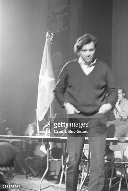 Hands in his pockets, German-born American concert promotor Bill Graham walks off the stage at the Filmore East during the venue's takeover by...