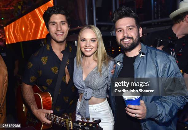 Danielle Bradbery poes with Dan Smyers and Shay Mooney of musical group Dan + Shay backstage at the 2018 iHeartCountry Festival By AT&T at The Frank...