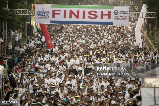 Members of religious group Iglesia Ni Cristo participate on the second "Worldwide Walk to Fight Poverty" along Roxas Boulevard in Manila on May 6,...
