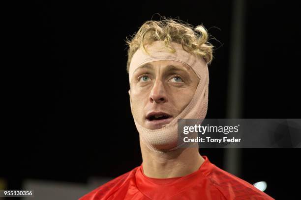 Lawrence Thomas of the Victory is bandaged up after getting injured during the 2018 A-League Grand Final match between the Newcastle Jets and the...