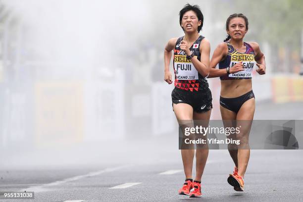 Nanako Fujii of Japan and Glenda Morejon of Ecuador in action during Women's 10 kilometres Race Walk of IAAF World Race Walking Team Championships...