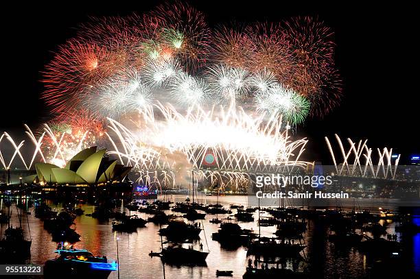Fireworks go off over the Opera House and the Harbour Bridge in Sydney Harbour to celebrate the new year on December 31, 2009 in Sydney, Australia.