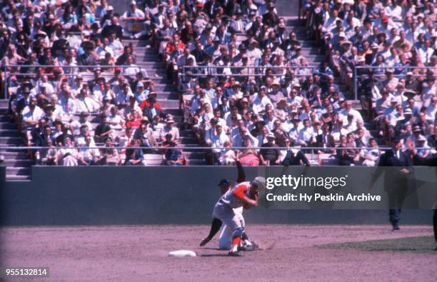 Don Blasingame of the Cincinnati Reds receives the ball as Harvey Kuenn of the San Francisco Giants slides during an MLB game on July 6, 1961 at...