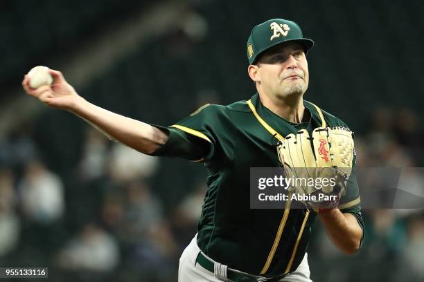 Andrew Triggs of the Oakland Athletics pitches in the fifth inning against the Seattle Mariners during their game at Safeco Field on May 1, 2018 in...