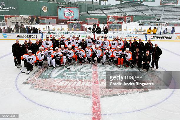 The Philadelphia Flyers pose for a team photo on the ice during practice prior to Bridgestone's presentation of 2010 NHL Winter Classic at Fenway...