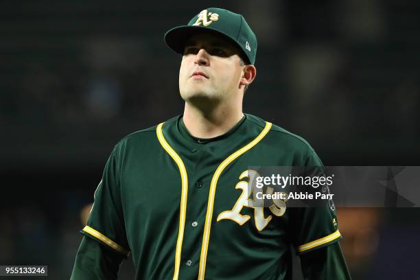 Andrew Triggs of the Oakland Athletics exits the game after giving up a three run home run to Nelson Cruz of the Seattle Mariners in the fifth inning...