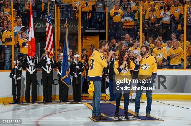Country artists Lady Antebellum sings the National Anthem prior to Game Five of the Western Conference Second Round against the Winnipeg Jets during...