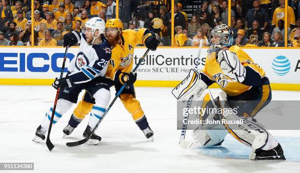 Paul Stastny of the Winnipeg Jets battles against Ryan Ellis and Pekka Rinne of the Nashville Predators in Game Five of the Western Conference Second...