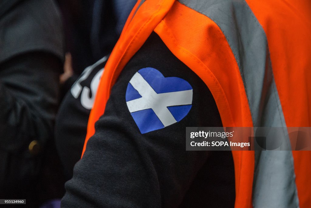 A patch of the Scottish Flag in the shape of a heart on a...