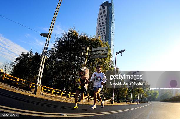 View of runners in action during the San Silvestre Road Race at the Reforma Avenue on December 31, 2009 in Mexico City, Mexico. Mexico's race...