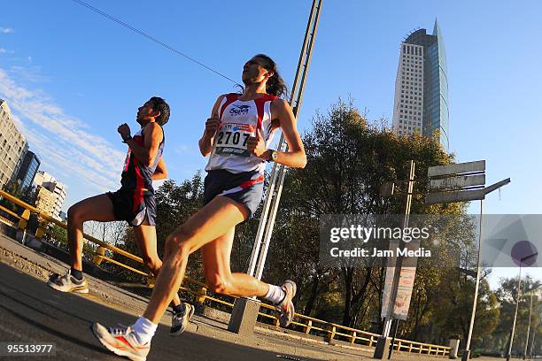 View of runners in action during the San Silvestre Road Race at the Reforma Avenue on December 31, 2009 in Mexico City, Mexico. Mexico's race...