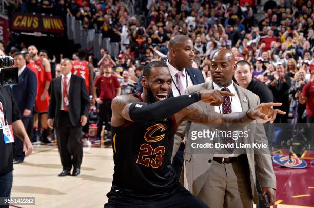 LeBron James of the Cleveland Cavaliers reacts after hitting the game winning point to give the Cleveland Cavaliers a 3-0 lead in the series against...