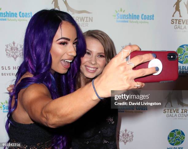 Pro wrestler Sasha Banks and conservationist/TV personality Bindi Irwin pose for a selfie at the Steve Irwin Gala Dinner 2018 at SLS Hotel on May 5,...