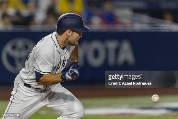 Left fielder Matt Szczur of San Diego Padres tries to make a bunt in the seventh inning during the MLB game against the Los Angeles Dodgers at...