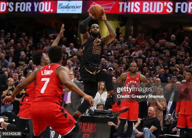 LeBron James of the Cleveland Cavaliers hits the game winning shot over the outstretched hand of OG Anunoby of the Toronto Raptors to win Game Three...