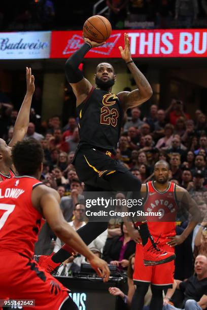 LeBron James of the Cleveland Cavaliers hits the game winning shot over the outstretched hand of OG Anunoby of the Toronto Raptors to win Game Three...