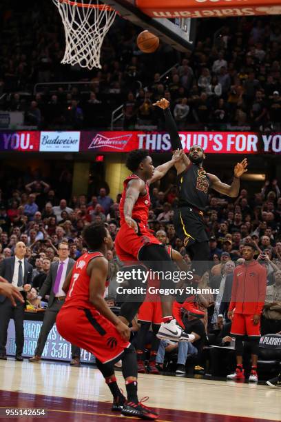 LeBron James of the Cleveland Cavaliers hits the game winning shot over the outstretched hand of OG Anunoby of the Toronto Raptors to win Game Three...