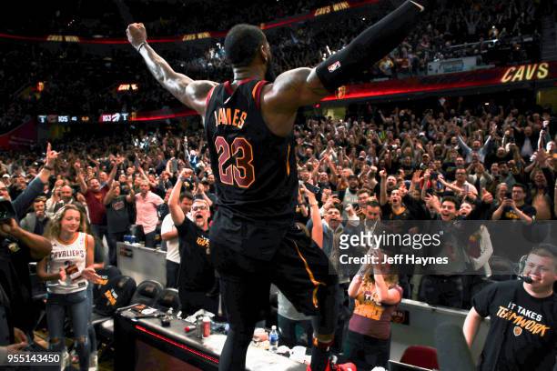 LeBron James of the Cleveland Cavaliers and Cleveland Cavaliers fans react after game winning shot against the Toronto Raptors after Game Three of...