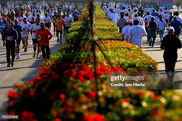 View of runners in action during the San Silvestre Road Race at the Reforma Avenue on December 31, 2009 in Mexico City, Mexico. Mexico's race...