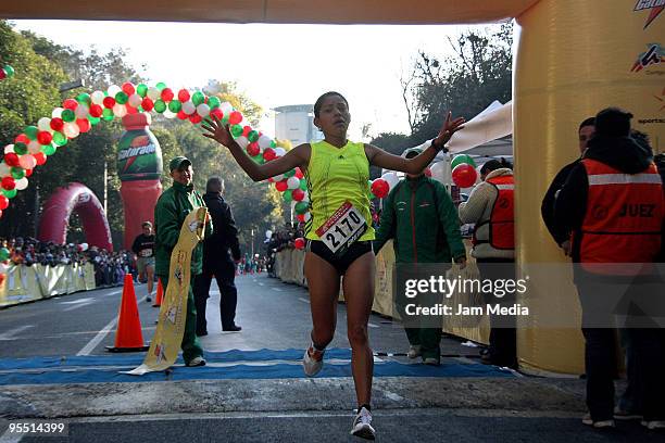 Marisol Guadalupe Romero of Mexico wins the San Silvestre Road Race at the Reforma Avenue on December 31, 2009 in Mexico City, Mexico. Mexico's race...