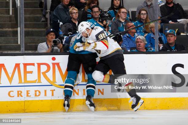 Tomas Tatar of the Vegas Golden Knights checks Melker Karlsson of the San Jose Sharks into the boards in Game Four of the Western Conference Second...