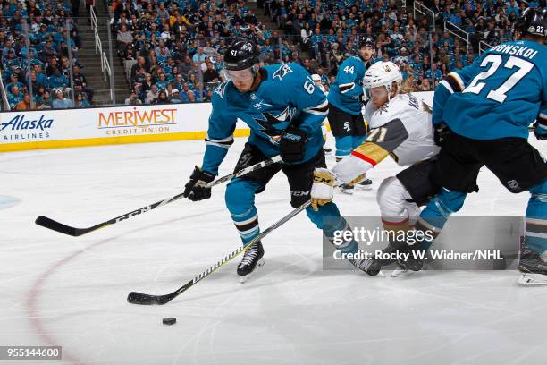 William Karlsson of the Vegas Golden Knights skates after the puck against Justin Braun of the San Jose Sharks in Game Four of the Western Conference...