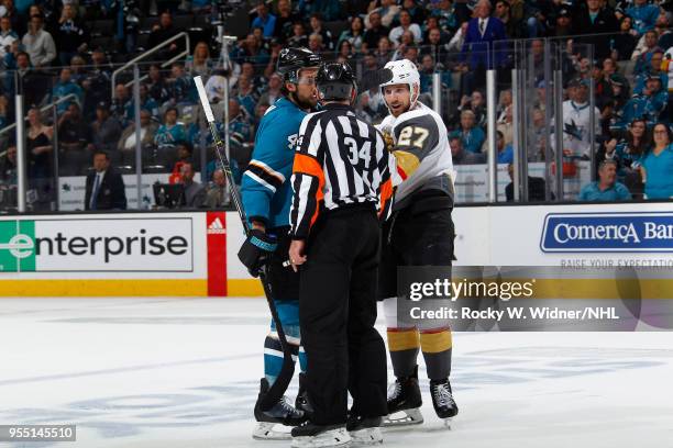 Referee separates Brenden Dillon of the San Jose Sharks and Shea Theodore of the Vegas Golden Knights in Game Four of the Western Conference Second...