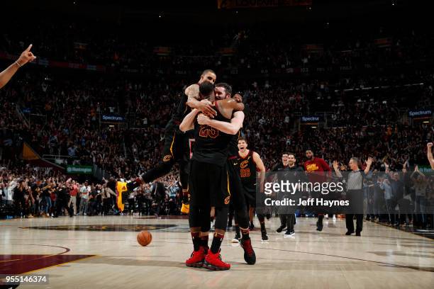 LeBron James, Kevin Love, Kyle Korver, George Hill of the Cleveland Cavaliers react after game winning shot against the Toronto Raptors during Game...