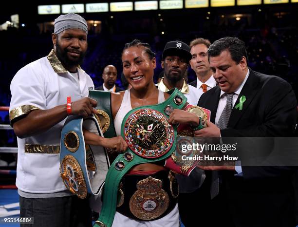 Cecilia Braekhus of Norway poses with her belts after defeating Kali Reis in a unanimous decision in the World Welterweight Championship at StubHub...