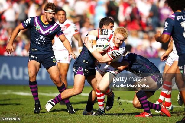 James Graham of the Dragons is tackled during the round nine NRL match between the St George Illawarra Dragons and the Melbourne Storm at UOW Jubilee...